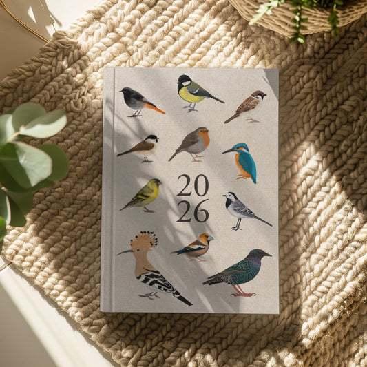 Vogel Planer 2026 Cover mit Illustrationen heimischer Vögel auf Leinenpapier